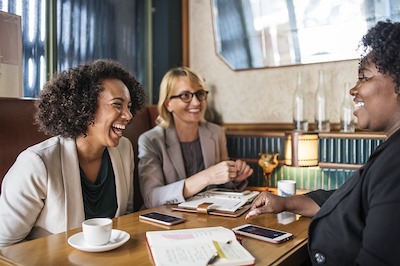 people laughing in a meeting