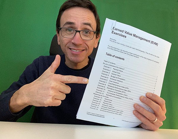 Adrian holding the Earned Value Management Exercises and Answers PDF (you can get it here)